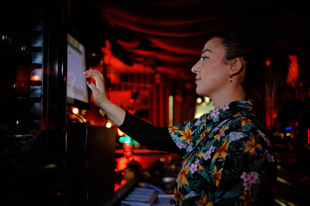 woman-using-touch-screen-computer-while-working-be-2025-03-05-05-12-00-utc